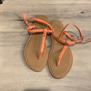 Orange and tan flip flops size 6
